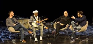 Nile Rodgers demonstrates his writing process with his famous "hitmaker" stratocaster during a live Sodajerker podcast at Meltdown